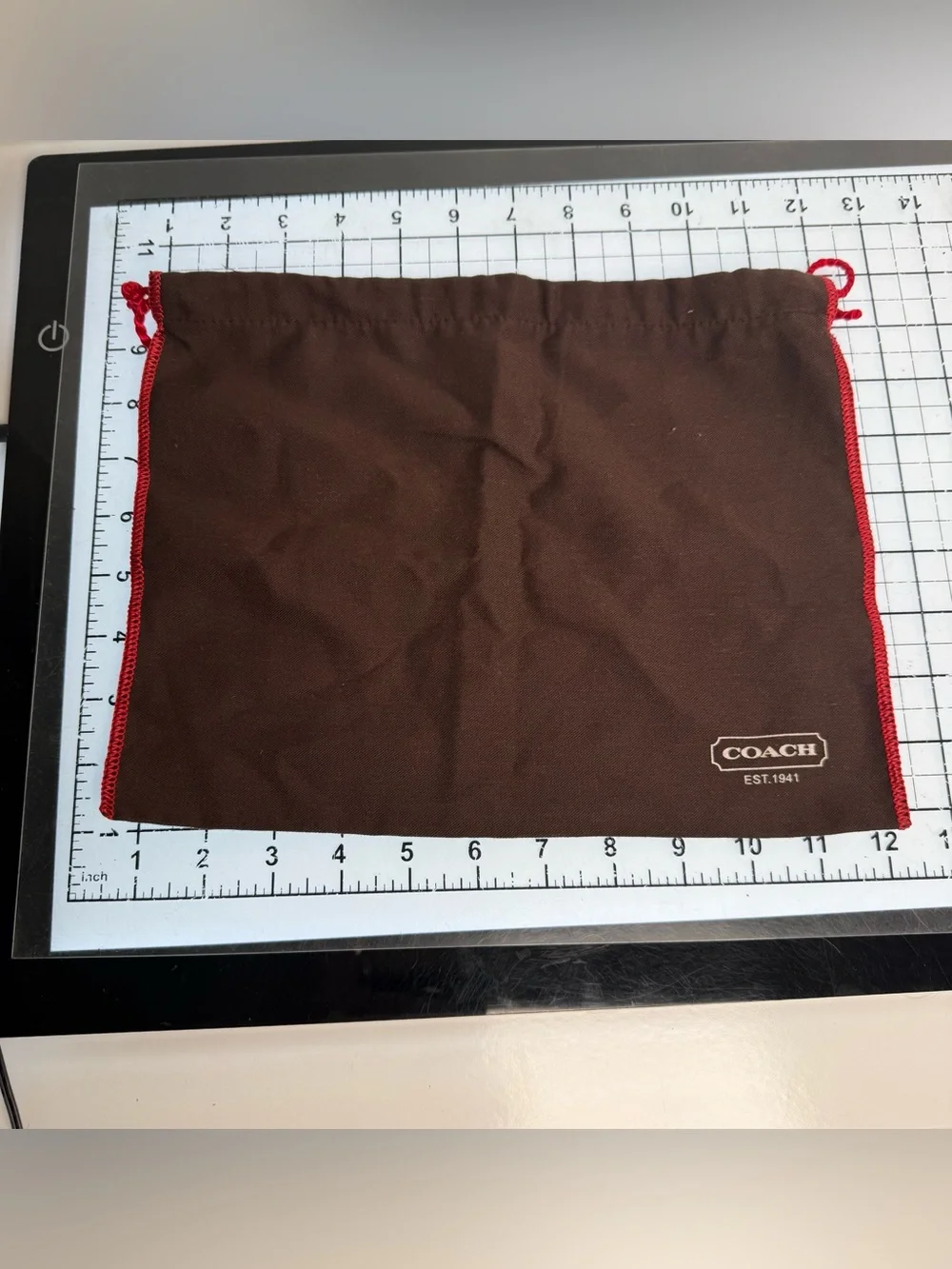 COACH Brown Drawstring Dust Bag with Red Trim. 12 by 9 inches